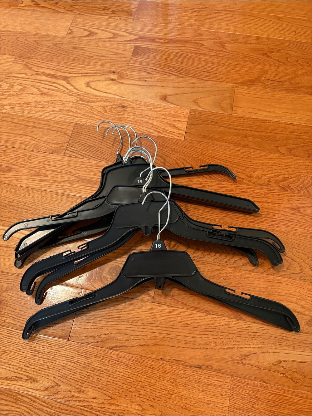 Set of 10 black plastic hangers